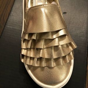 Kenneth Cole gold toddler shoes.